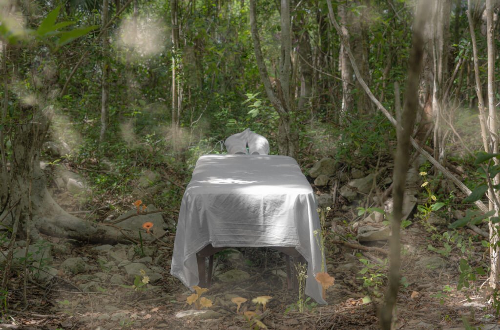 Outdoor massage table set in the jungle for a nature-inspired wellness ritual in the Riviera Maya.